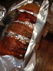 In another sheet of aluminum foil, place your four pieces of salmon and separate with aluminum foil. Then rub in marinades for each.